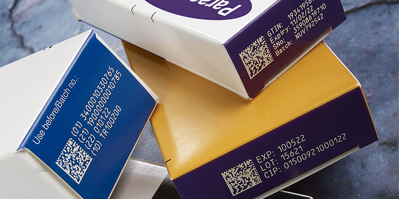 Sample codes, including batch and data matrix codes, on pharmaceutical carton packs